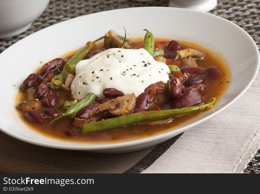 Vegetable chilli with green beans and creme fraiche