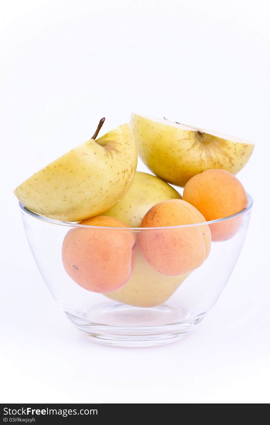 Fresh apricot and apples in dish