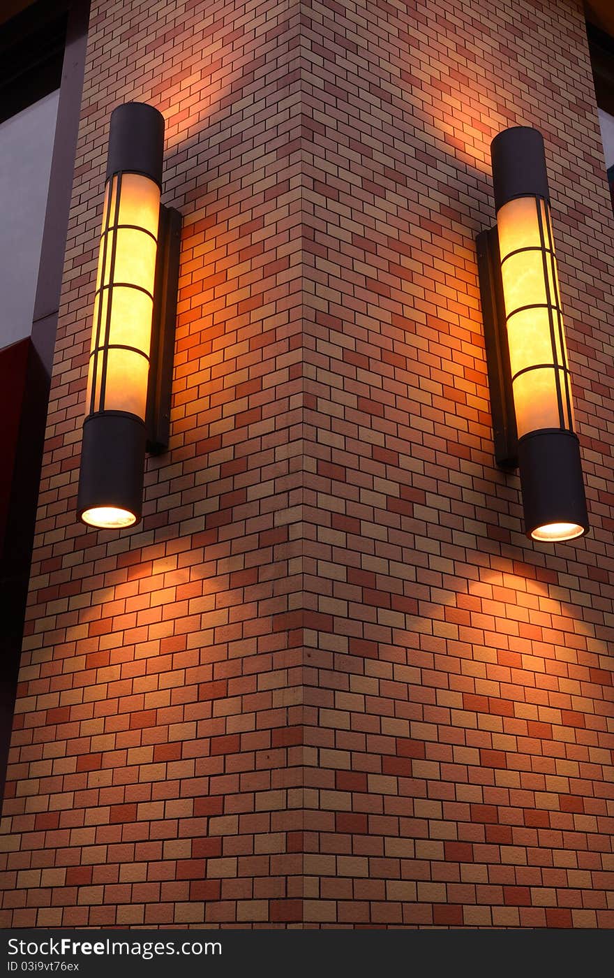 This is the exterior wall lamps of a fast-food restaurant, giving warm sense.