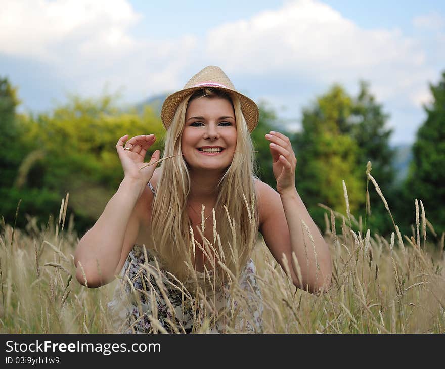 Pretty summer woman in countryside