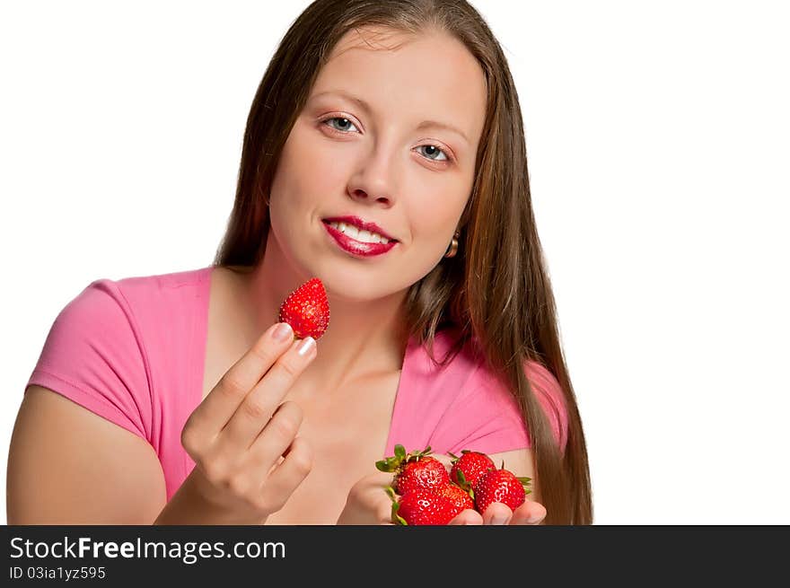 Beautiful girl stretches strawberries which is in her hand. Beautiful girl stretches strawberries which is in her hand