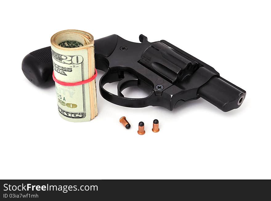 Revolver and dollars on a white background