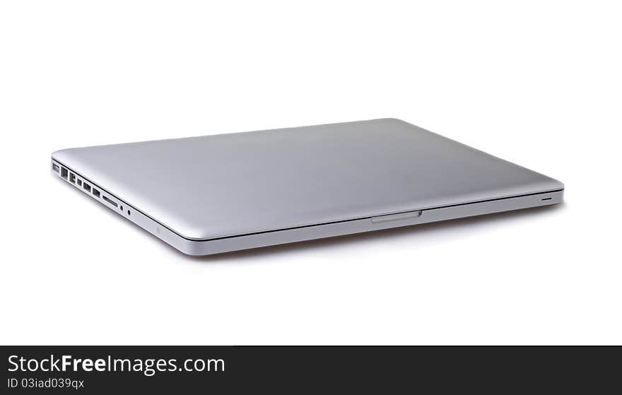 Silver portable computer. Isolated white screen. Silver portable computer. Isolated white screen.