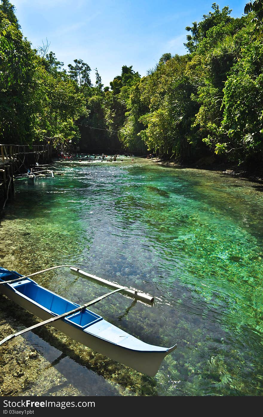 A solitary boat dock that invites tourists for a short trip around the narrow river