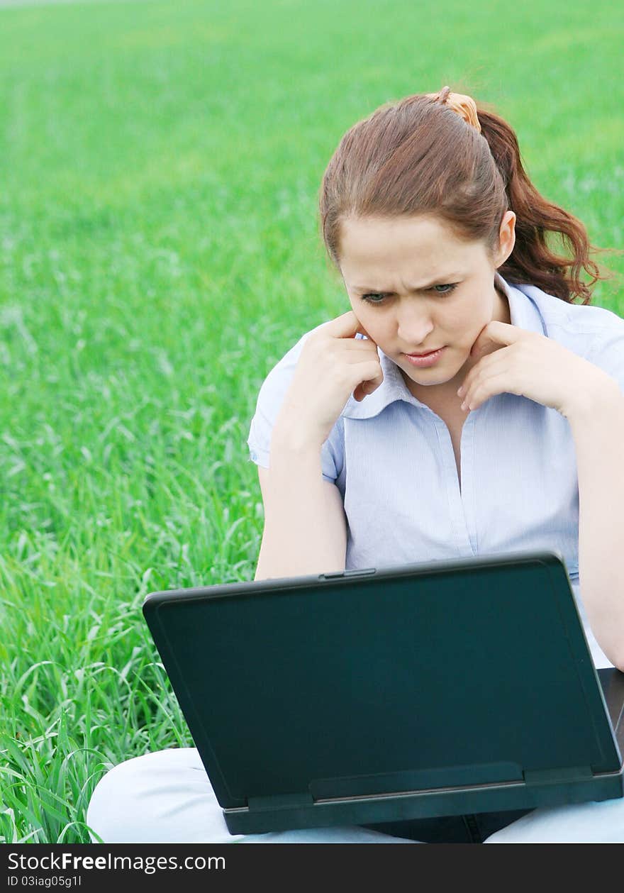 Girl sitting in the field