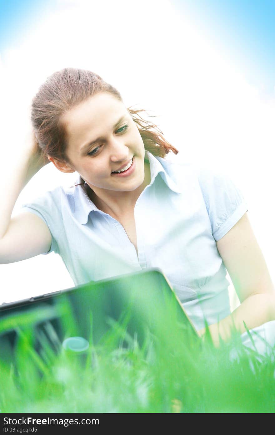 Girl sitting in the grass