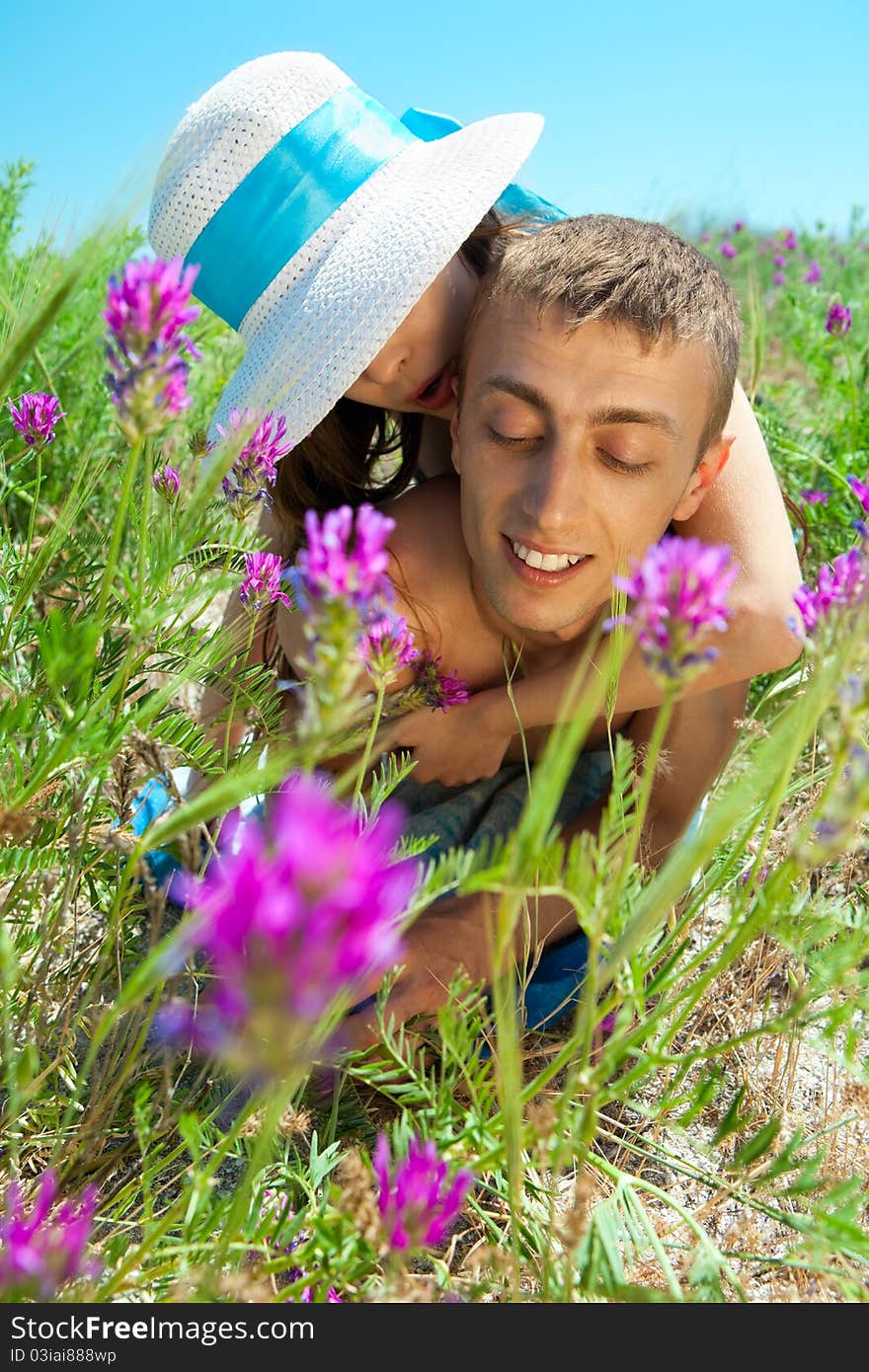 Young Couple Lying On Grass