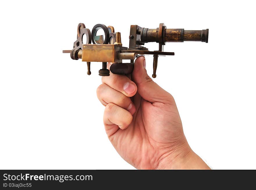 Old sextant in hand on a white background