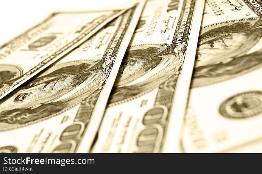 Hundreds of dollars spread on white background. Hundreds of dollars spread on white background