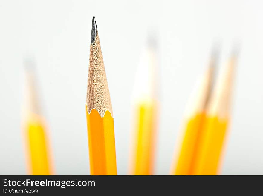 Yellow pencils against a white background