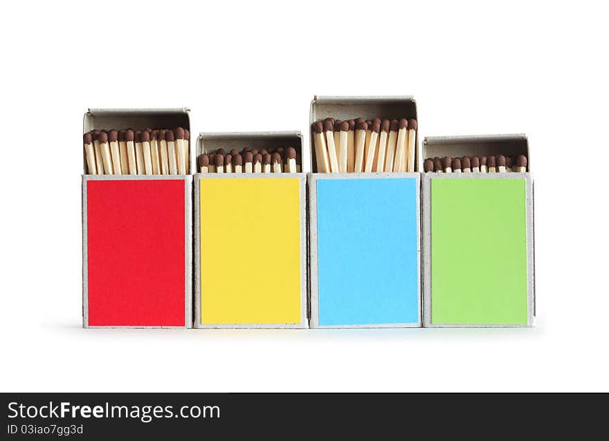 Few variegated matchboxes in a row isolated on white background. Clipping path is included. Few variegated matchboxes in a row isolated on white background. Clipping path is included