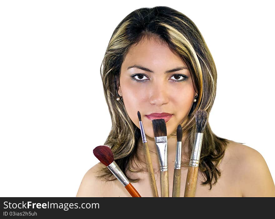 Portrait of beautiful woman with brushes