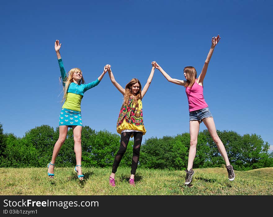 Group of young girls play and express positivity in park. Group of young girls play and express positivity in park