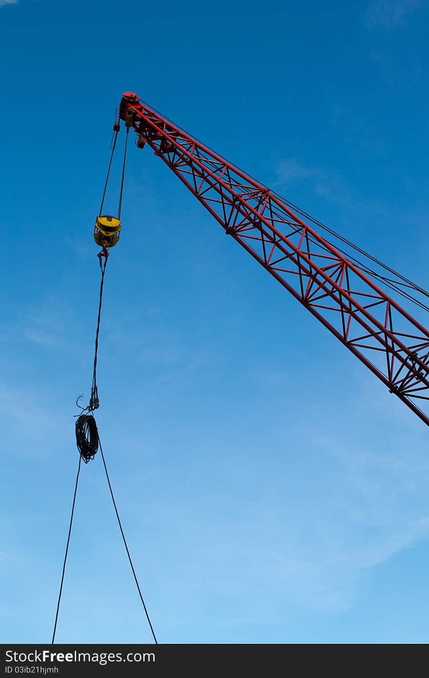 The elevating crane on blue sky