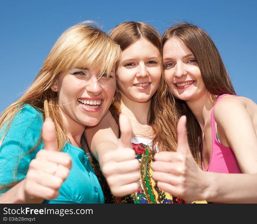 Group of young girls express positivity in park