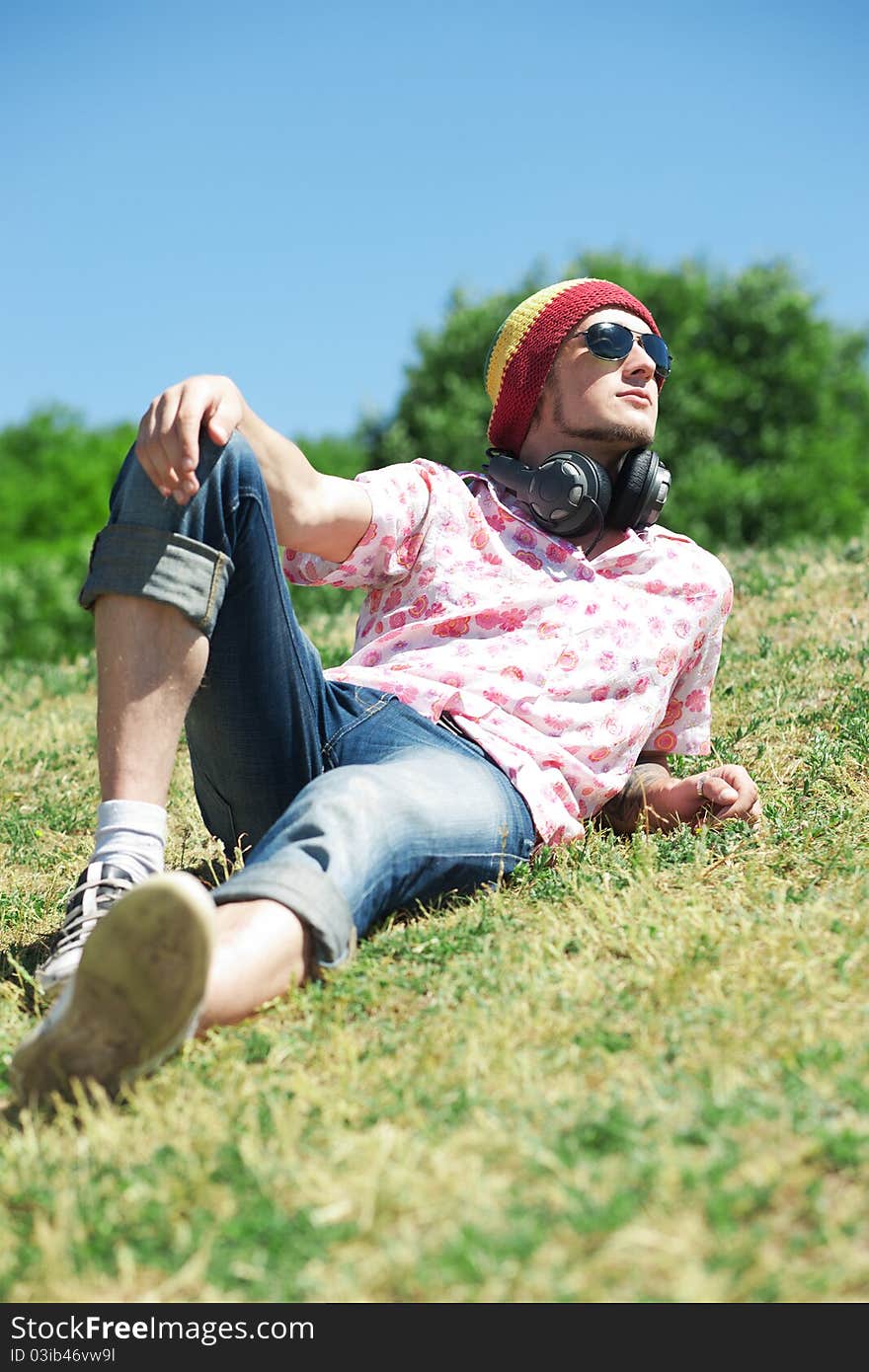 Young man  laying on grass