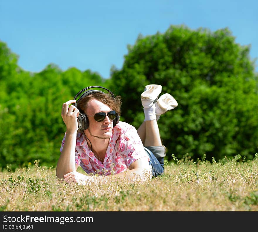 Young man  laying on grass