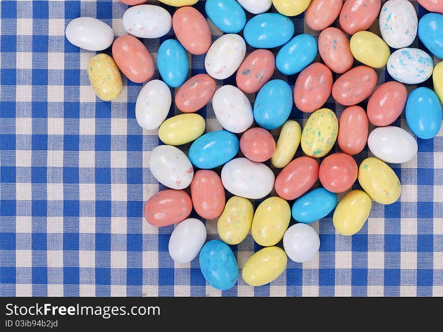 Colored Malt Chocolate Candies On Colorful Table Cloth