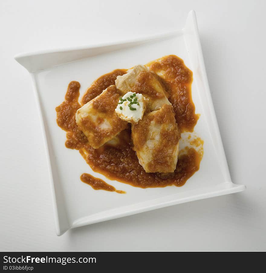 Hake detail two sauces on white background. Hake detail two sauces on white background