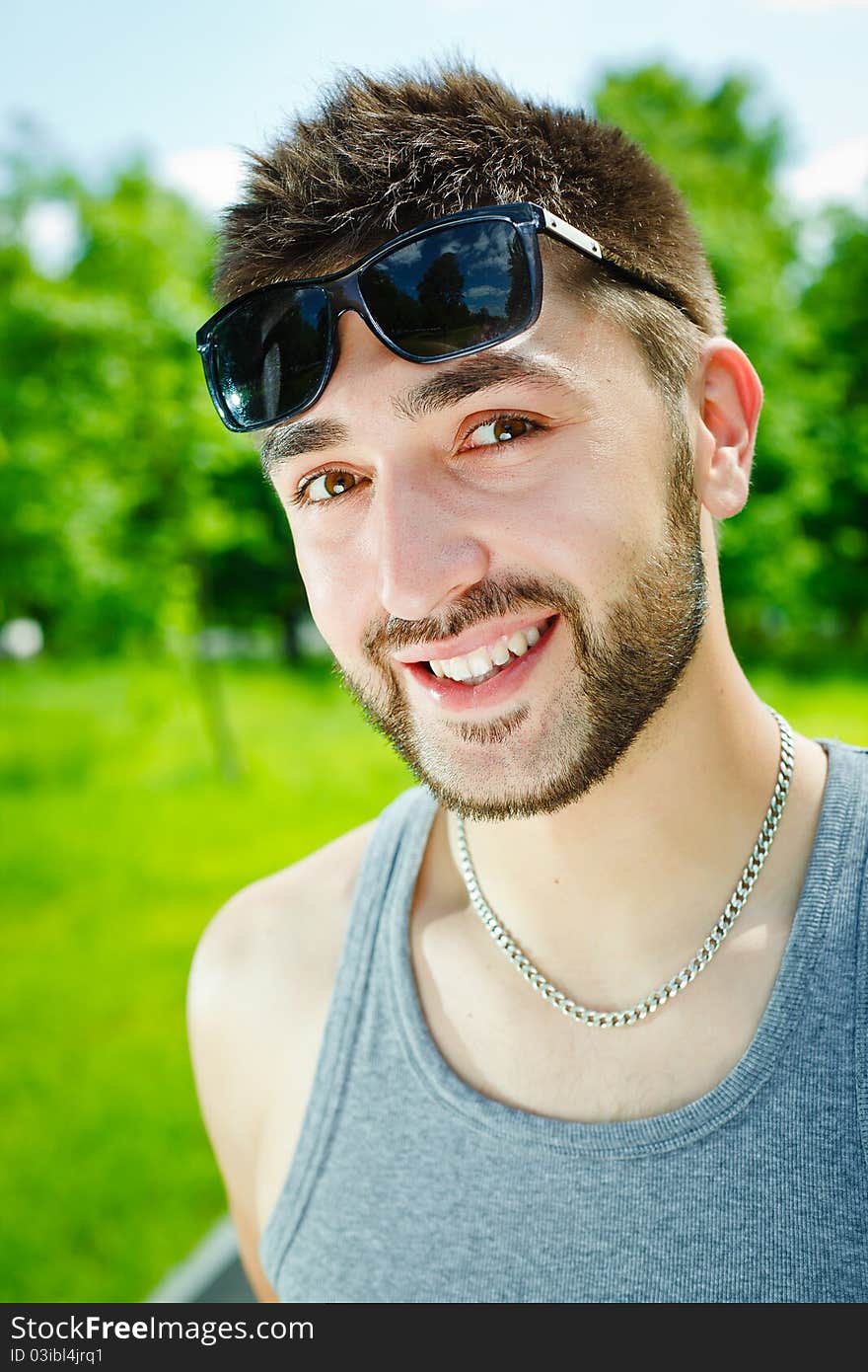 Young man in glasses on park. Young man in glasses on park