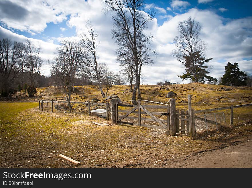 A wooden gate on a field in Sweden