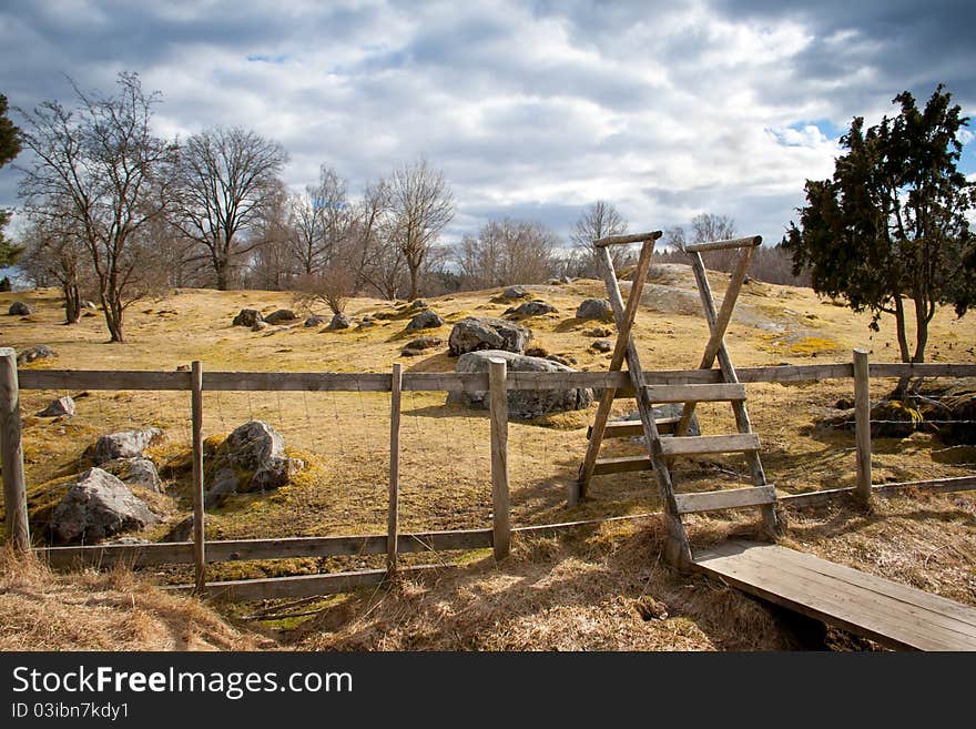 A wooden gate on a field in Sweden. A wooden gate on a field in Sweden