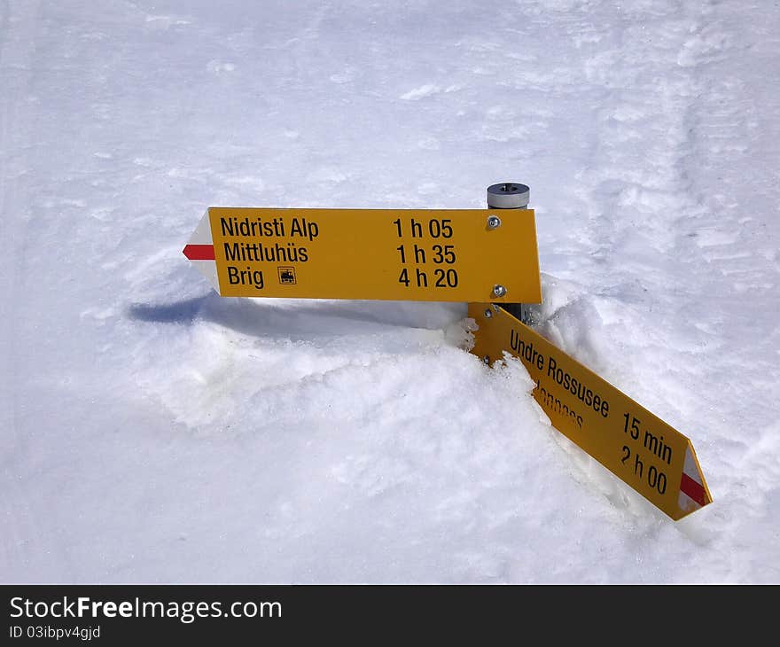 Signpostings under the snow climbing spitzhornli. Signpostings under the snow climbing spitzhornli