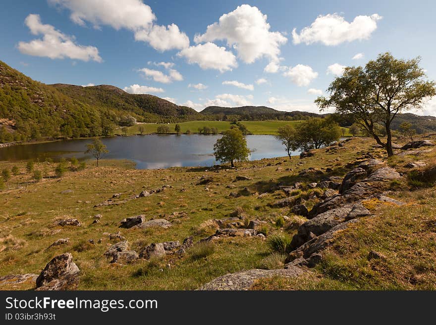 Wide angle view in the countryside of southern Norway. Wide angle view in the countryside of southern Norway