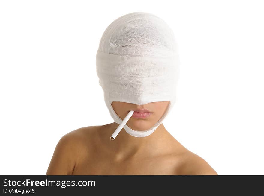 Woman with head bandaged with cigarette