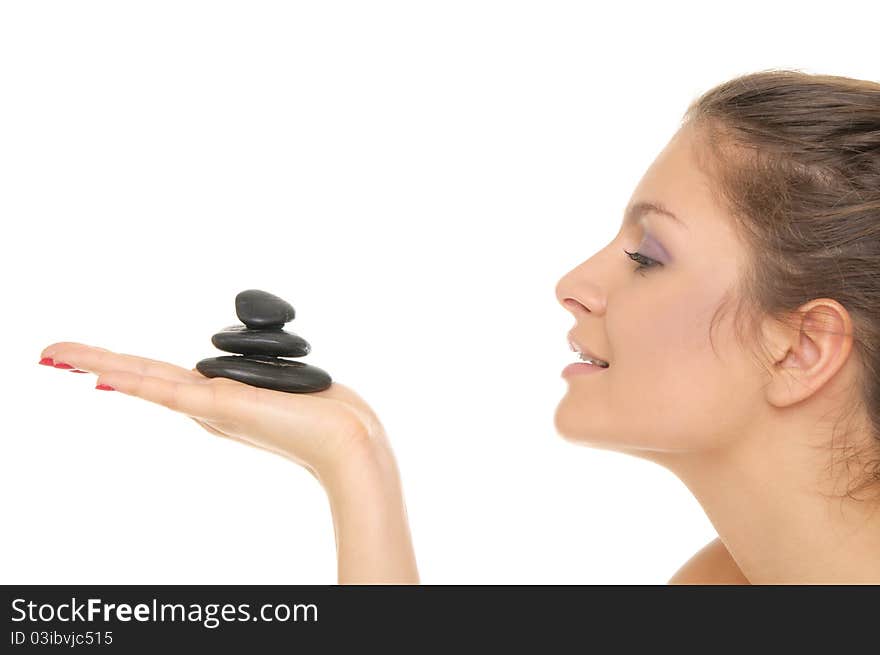 Woman holding pile of stones on the palm of your hand isolated on white. Woman holding pile of stones on the palm of your hand isolated on white