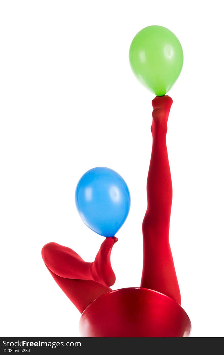 Female feet in red stockings with balloons isolated in white