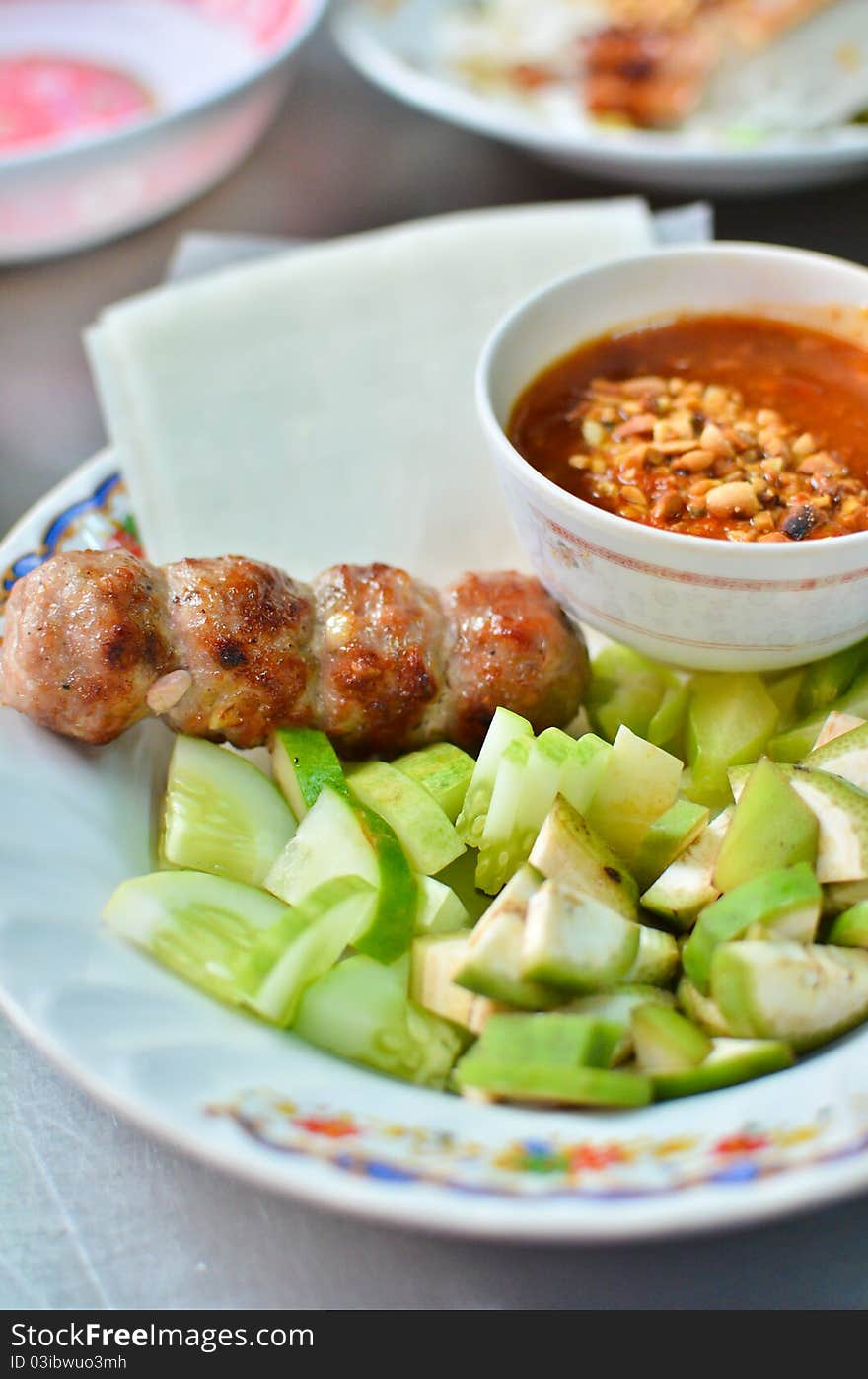 Fresh Vietnamese style food set , Grilled pork with vegetables and wrapping flour