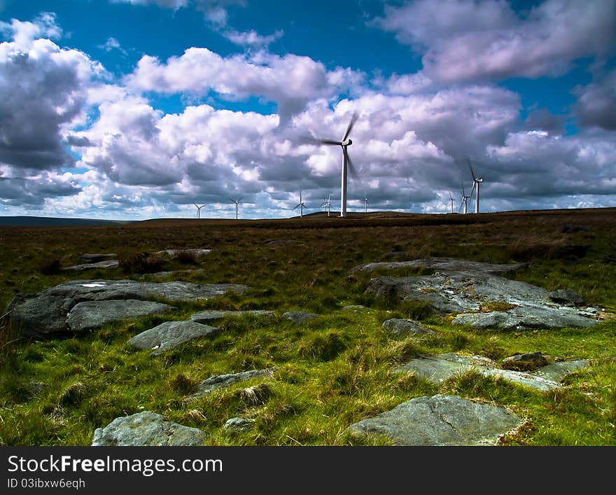 Wind turbines on a hill with big sky. Wind turbines on a hill with big sky