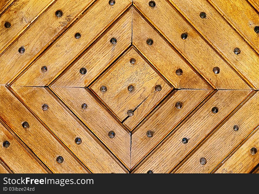 Natural wood background with iron rivets