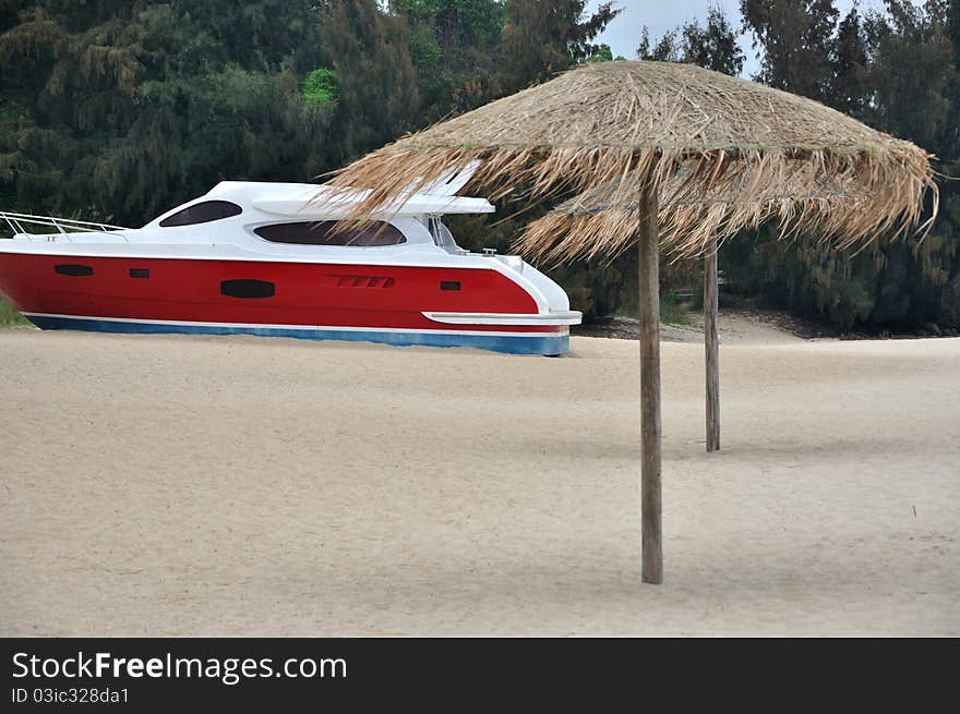 Beach Sand And Red Yacht