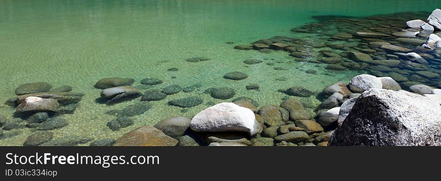 Panorama of shallow clear Lake Tahoe water