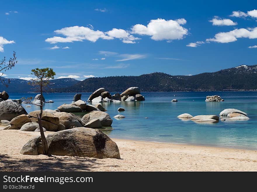 Lake Tahoe beach with few clouds