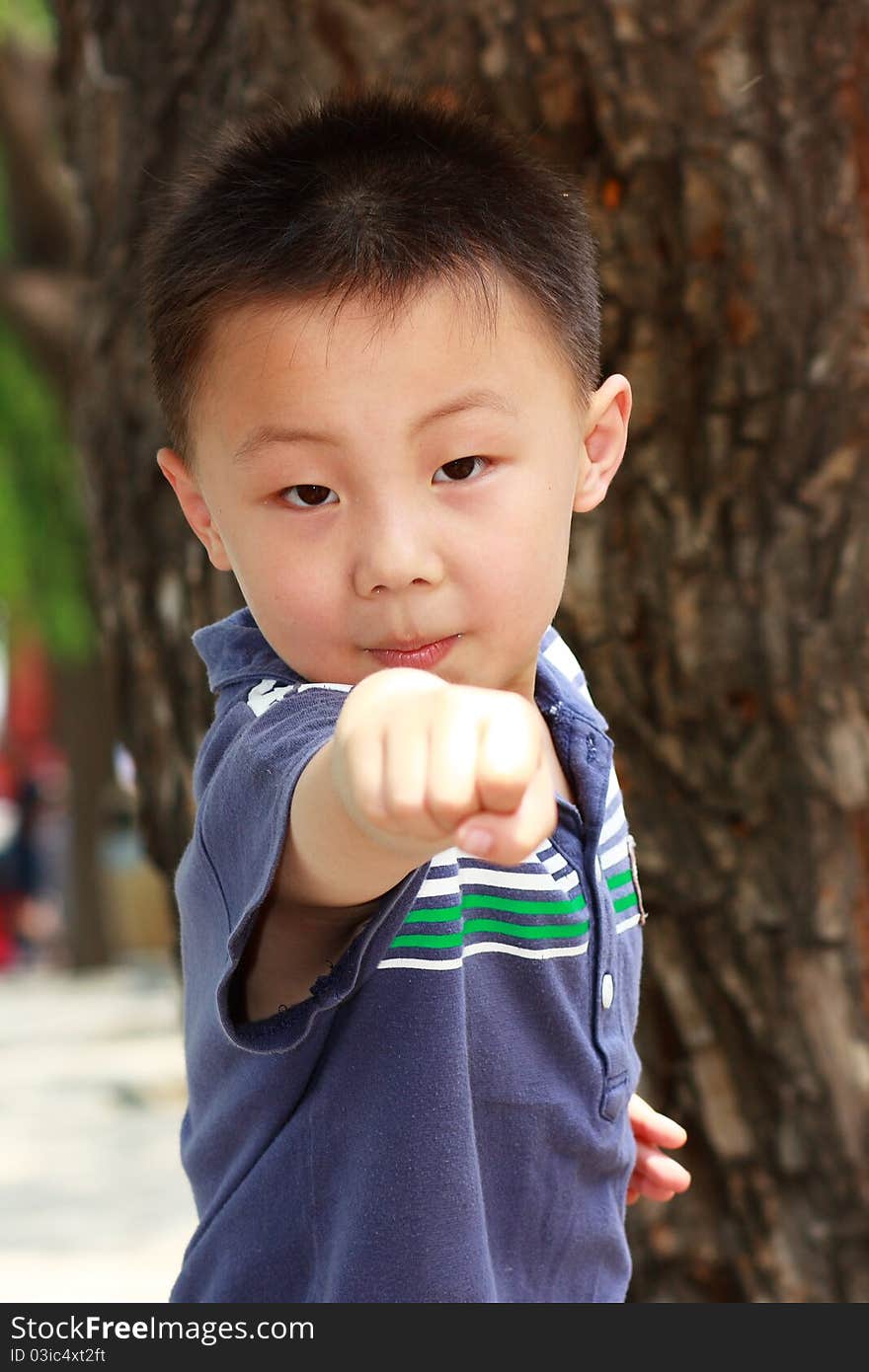 The portrait of an Asian boy who is doing exercises. The portrait of an Asian boy who is doing exercises.