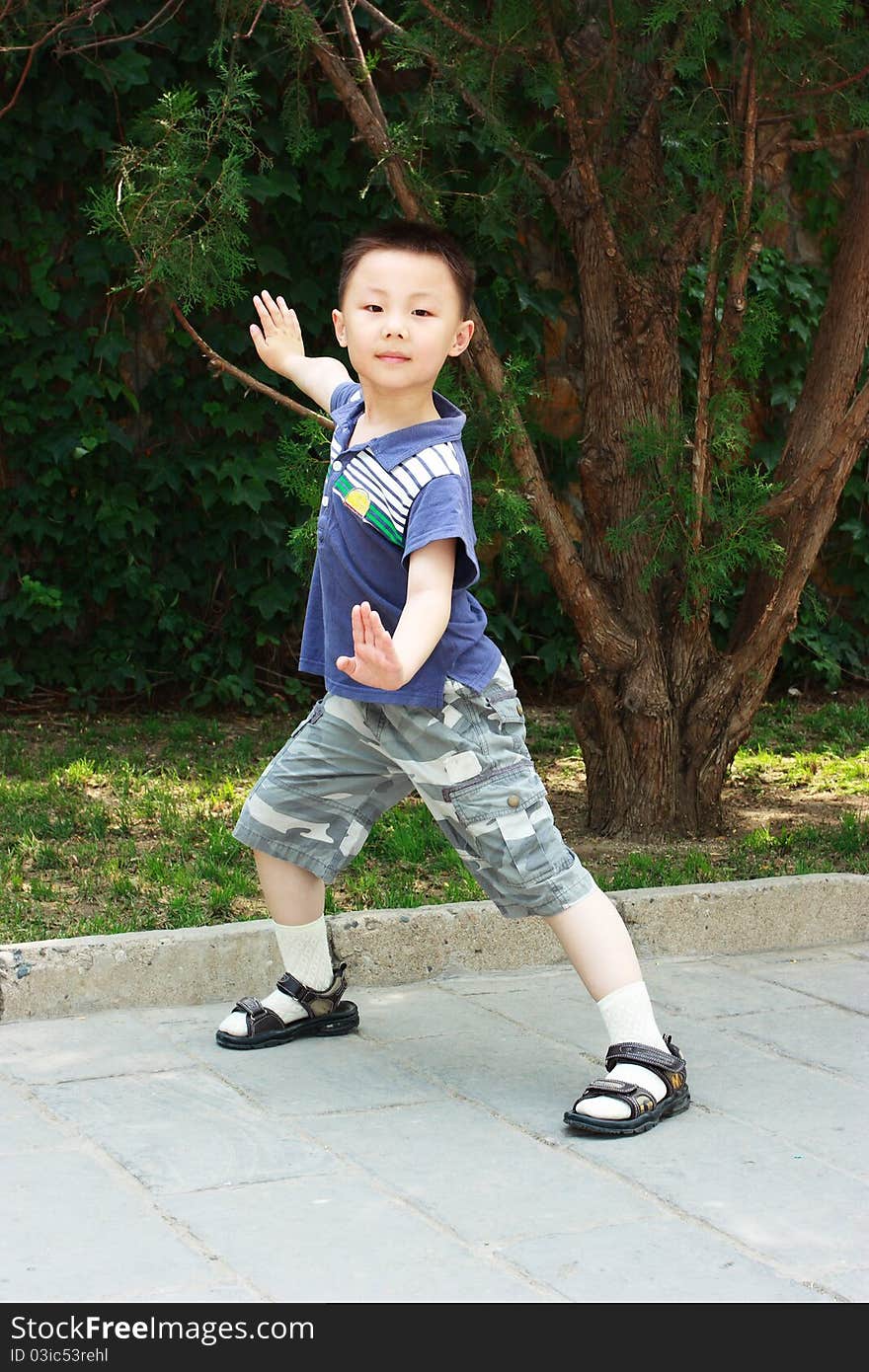 The portrait of an Asian boy who is doing exercises. The portrait of an Asian boy who is doing exercises.