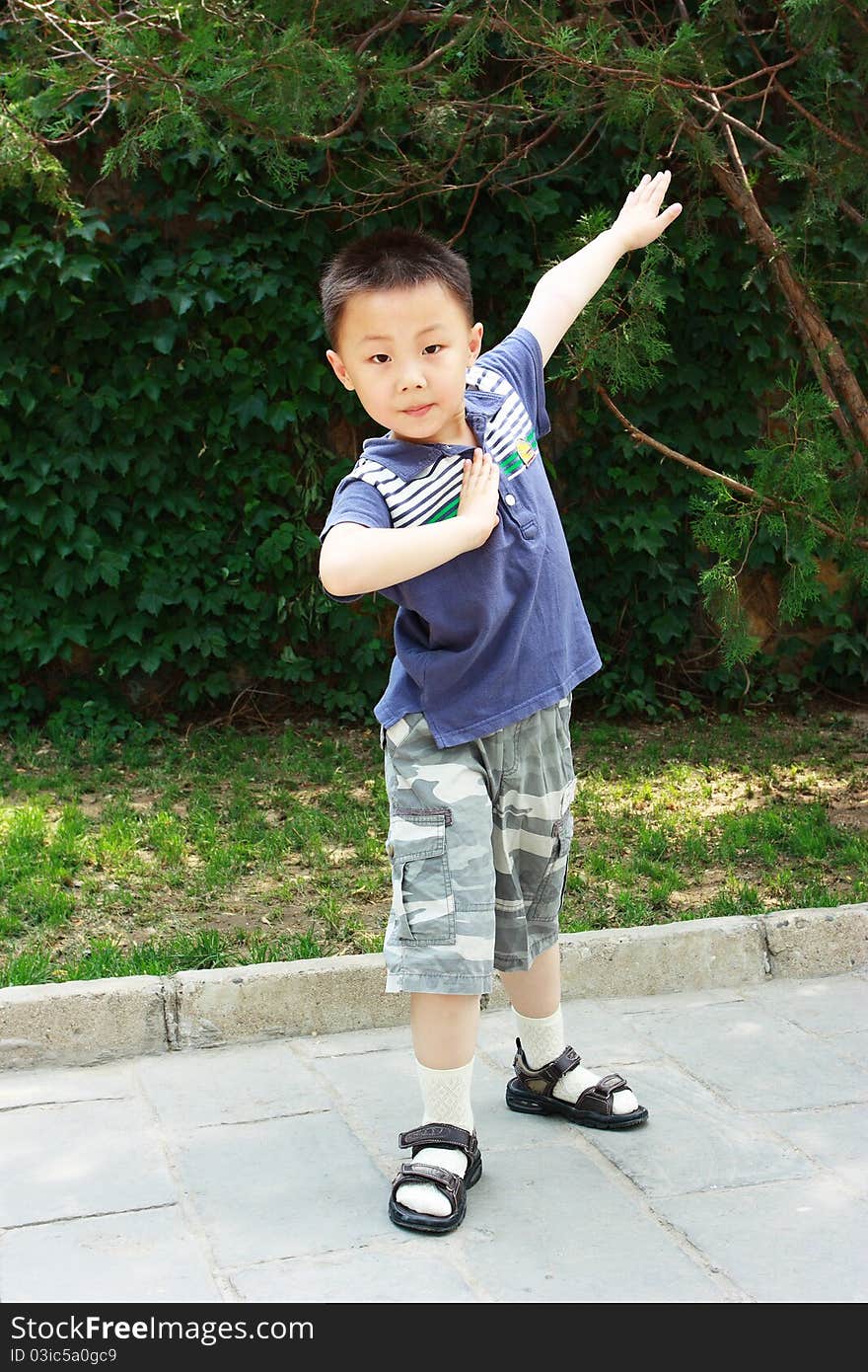 The portrait of an Asian boy who is doing exercises. The portrait of an Asian boy who is doing exercises.