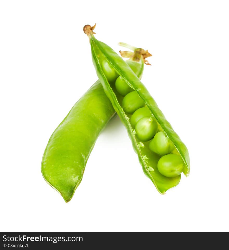 Ripe green peas in the shell on a white background