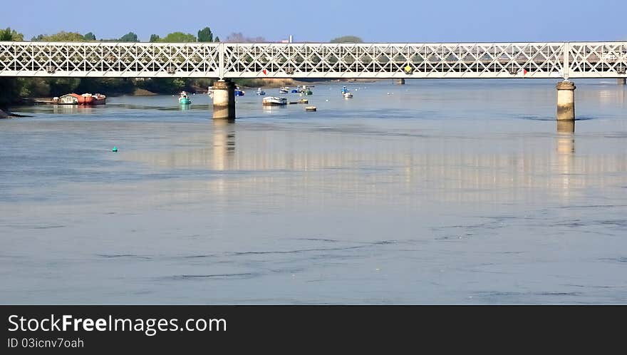 A bridge over small boats