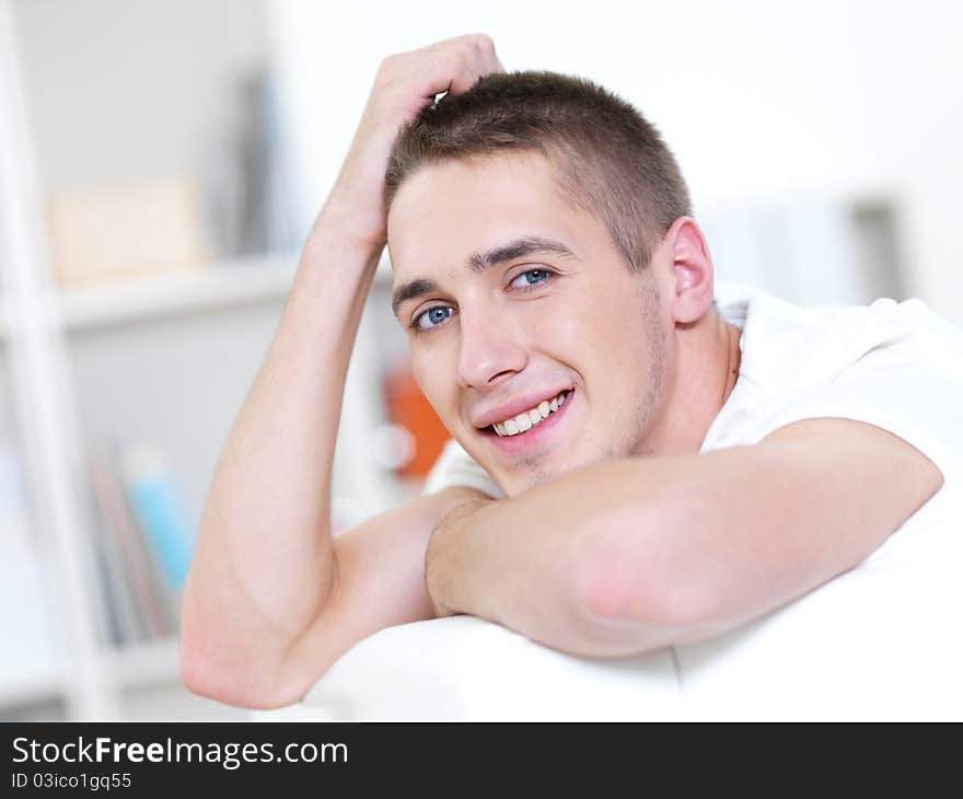 Portrait of happy young beautiful man at home. Portrait of happy young beautiful man at home