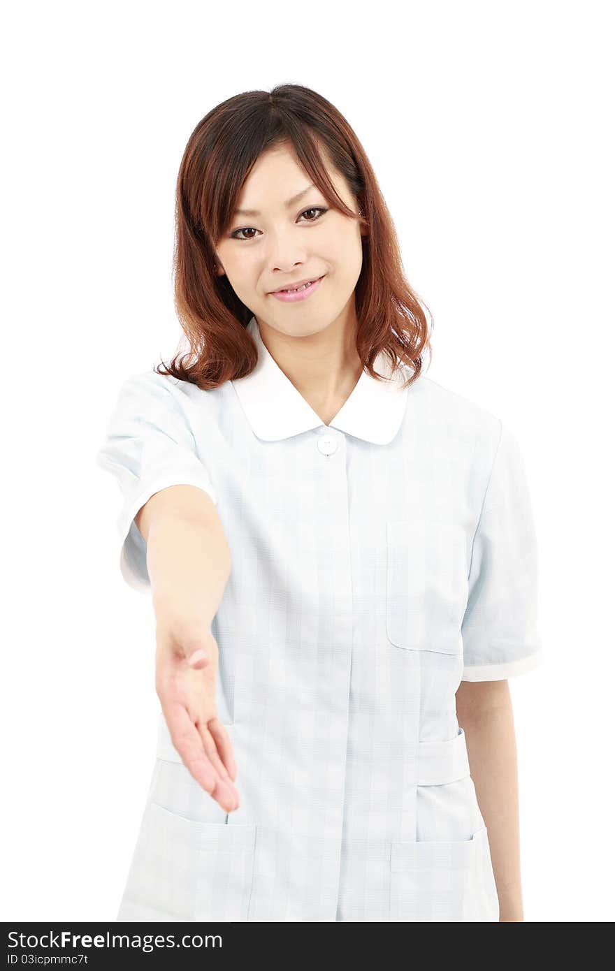 Young japan pretty smiling nurse giving her hand. Young japan pretty smiling nurse giving her hand