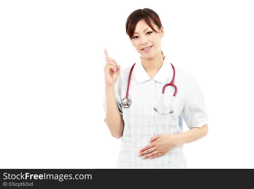 Young japanese female nurse pointing. Young japanese female nurse pointing