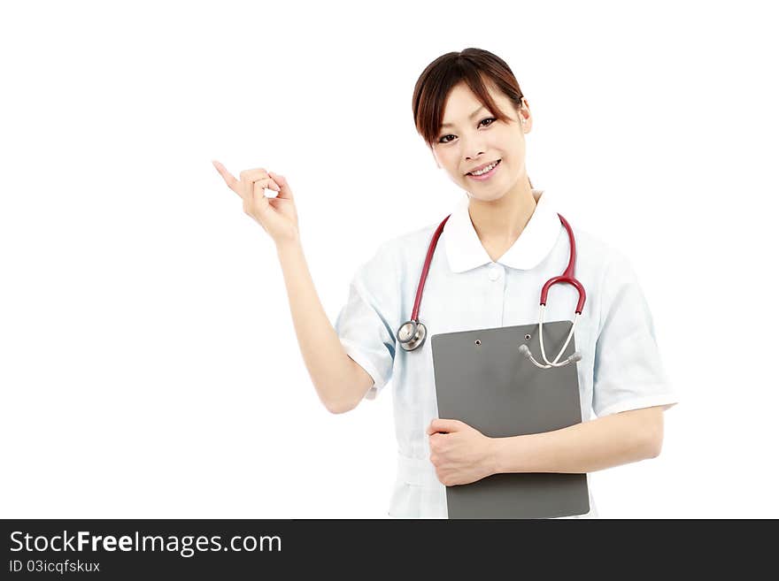 Young japanese female nurse pointing. Young japanese female nurse pointing