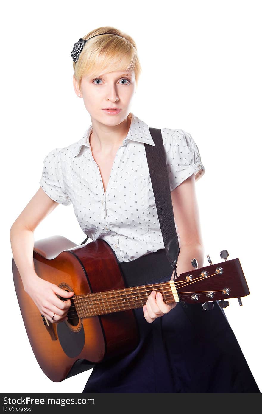 Young woman playing guitar on isolated white