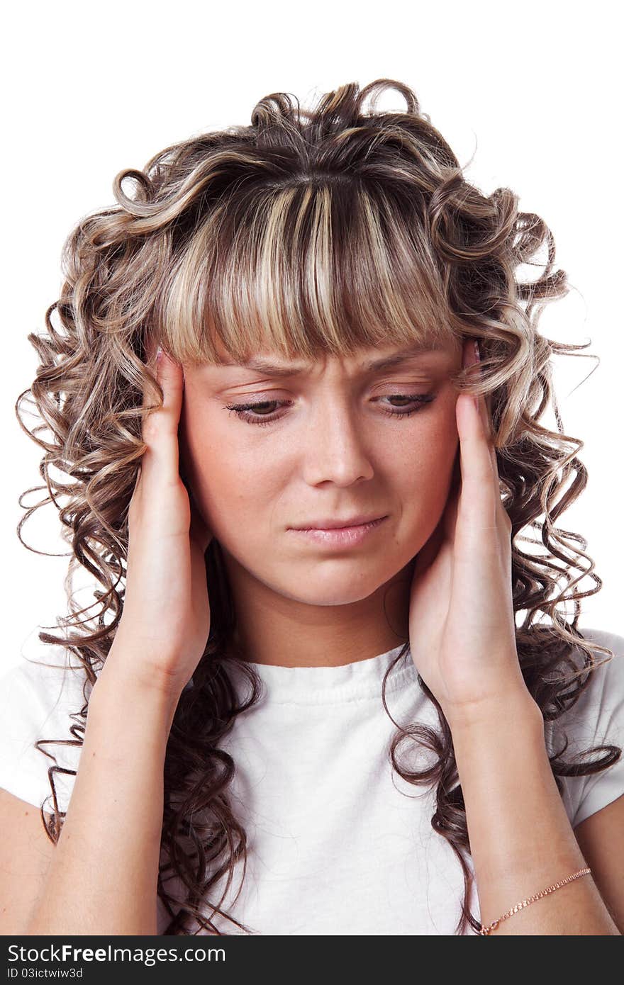 Young beautiful woman with the headache is touching her temples. Isolated over white background. !!! Right hand without little finger.!!!. Young beautiful woman with the headache is touching her temples. Isolated over white background. !!! Right hand without little finger.!!!