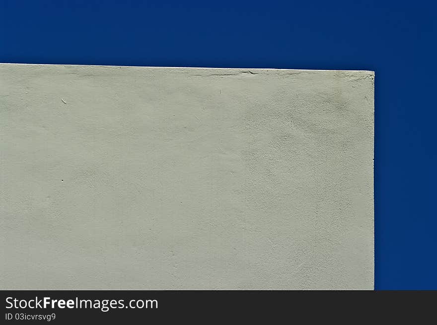 Windowless wall over blue sky