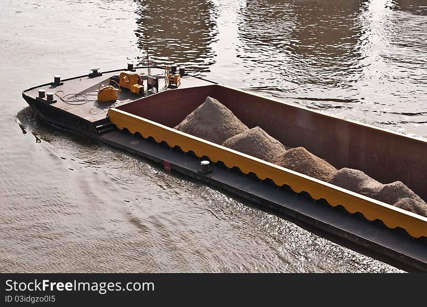 River cargo ship transporting gravel and sand. River cargo ship transporting gravel and sand